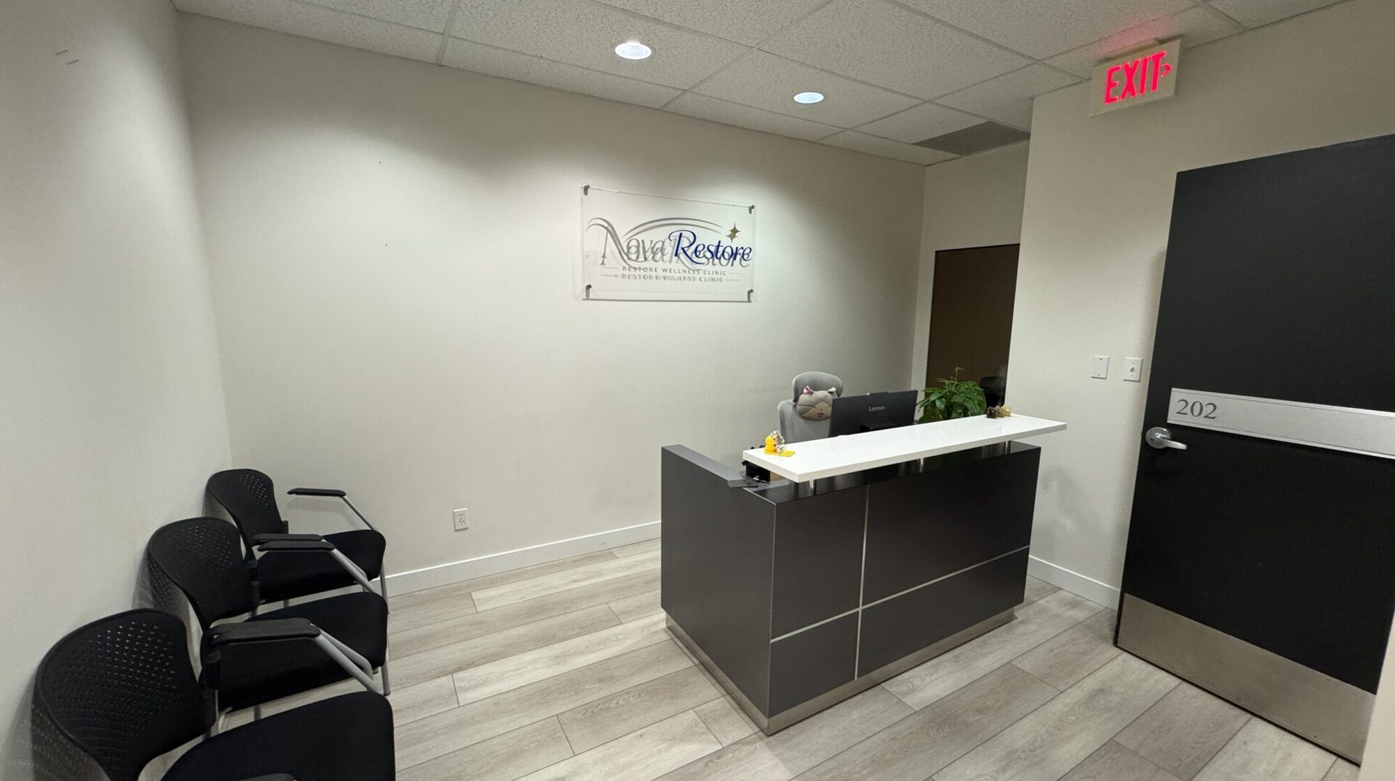 Reception and waiting area inside Nova Restore Wellness massage clinic in Metrotown, Burnaby