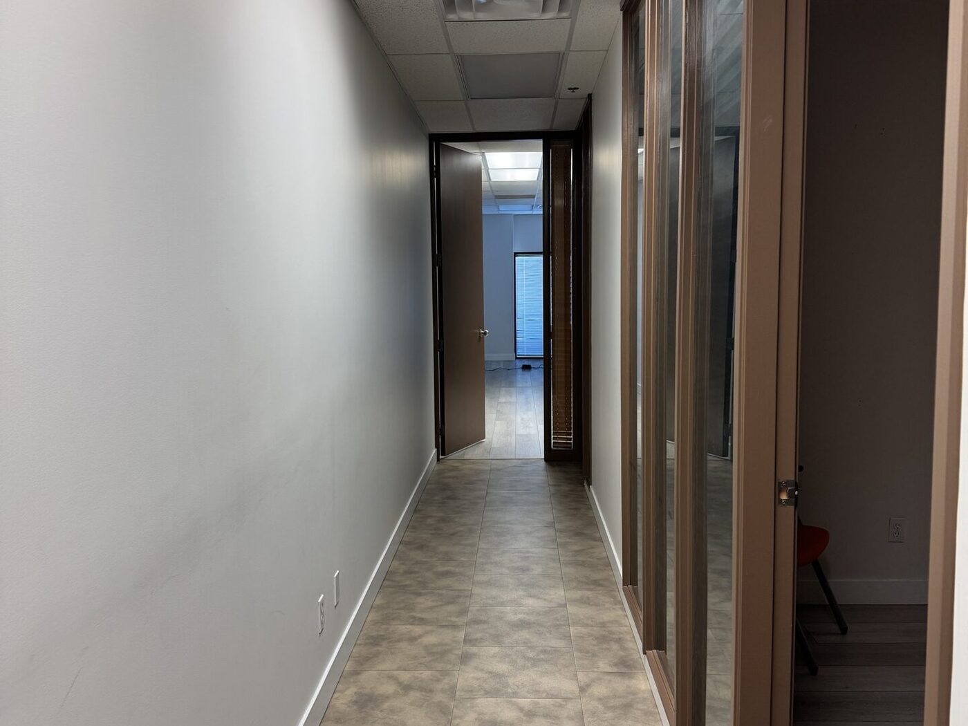 Hallway to private massage therapy treatment rooms at Nova Restore Wellness in Burnaby
