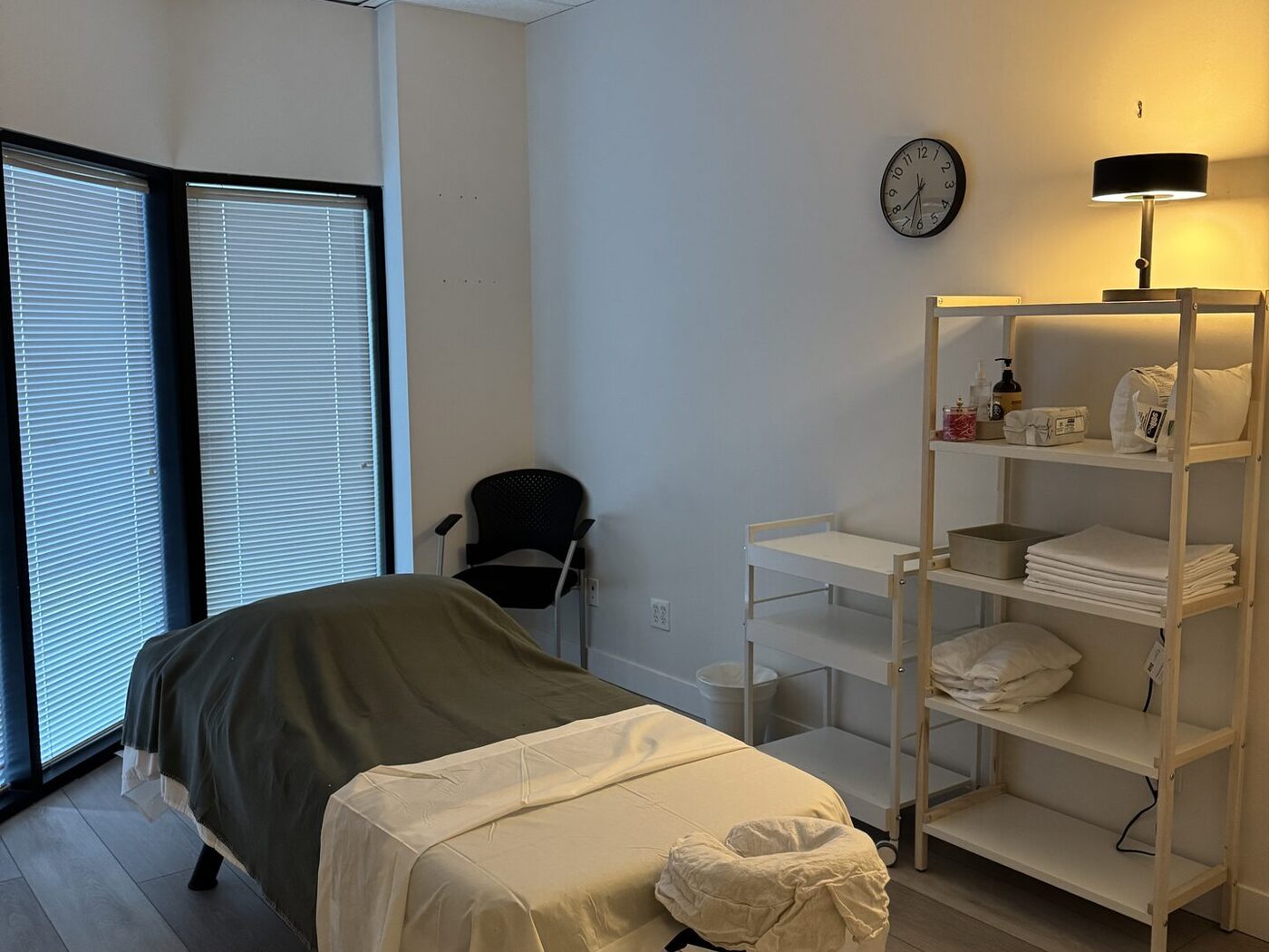 Registered massage therapy treatment room with natural light at Nova Restore Wellness in Burnaby
